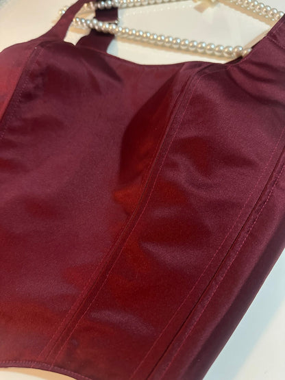 Close-up of a burgundy corset top