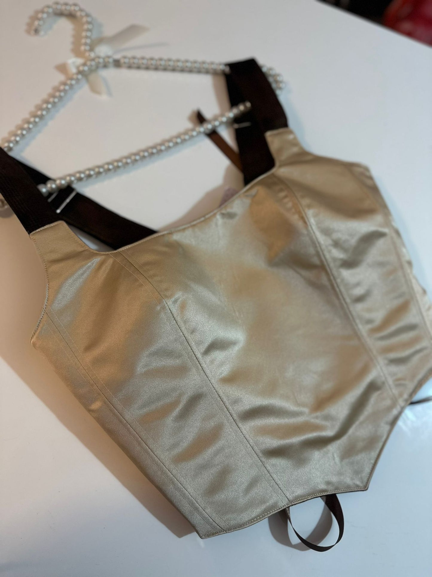 Beige corset top on a table